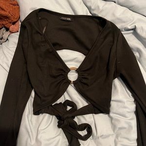 really cute black long sleeve crop top with an open back never worn fits s/m